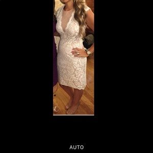 This is a white lace sheer front midi dress